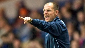 Allan Johnston points on the touchline