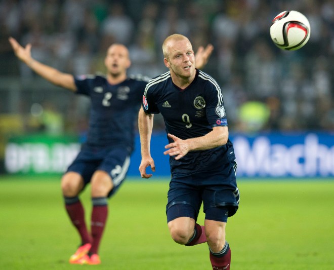 On the run - Naismith chases a wayward pass